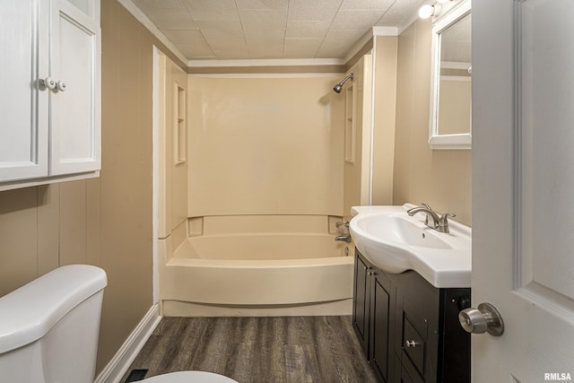 full bathroom featuring vanity, hardwood / wood-style flooring, tub / shower combination, and toilet