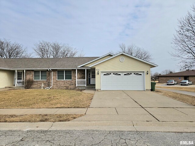 single story home with a garage and a front yard