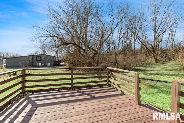 wooden deck with a lawn