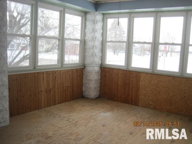 unfurnished sunroom with a healthy amount of sunlight