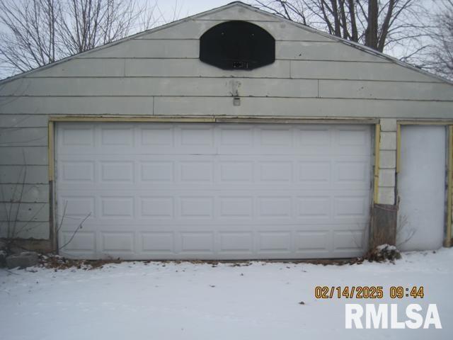 view of snow covered garage