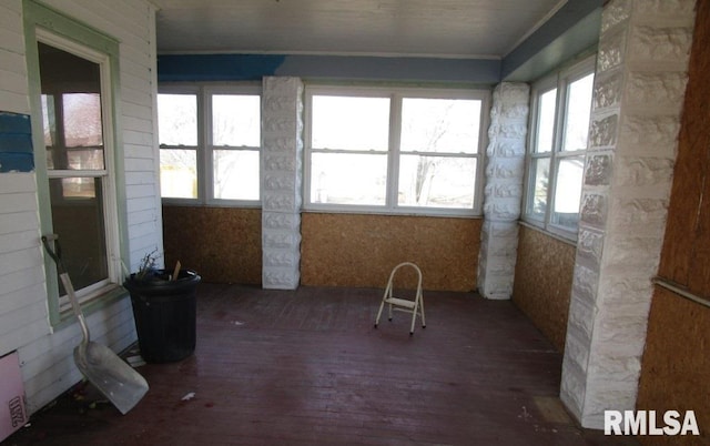 unfurnished sunroom featuring a healthy amount of sunlight