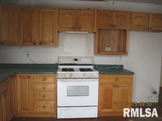 kitchen with white gas range