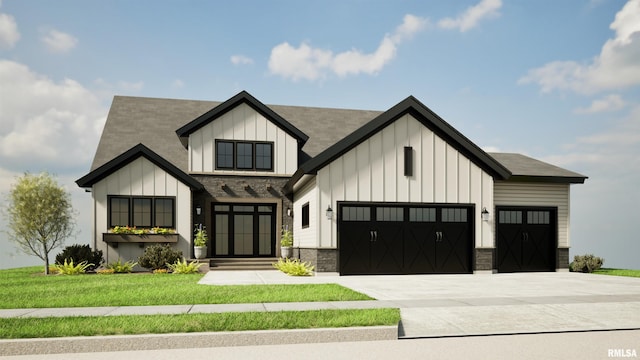 modern inspired farmhouse with an attached garage, a front yard, board and batten siding, and concrete driveway