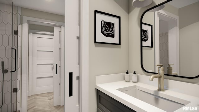 bathroom with a shower with door and vanity