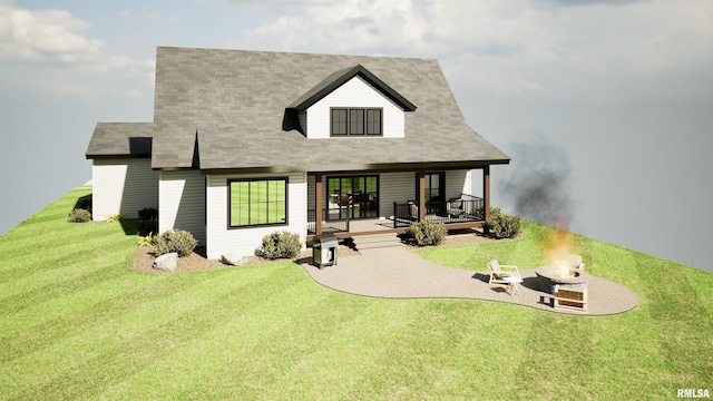 rear view of property featuring an outdoor fire pit, a lawn, and a deck