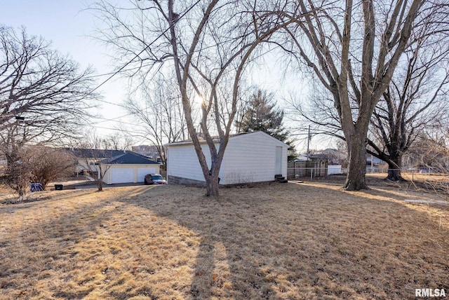 view of property exterior featuring a garage and a yard