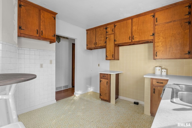 kitchen with tile walls