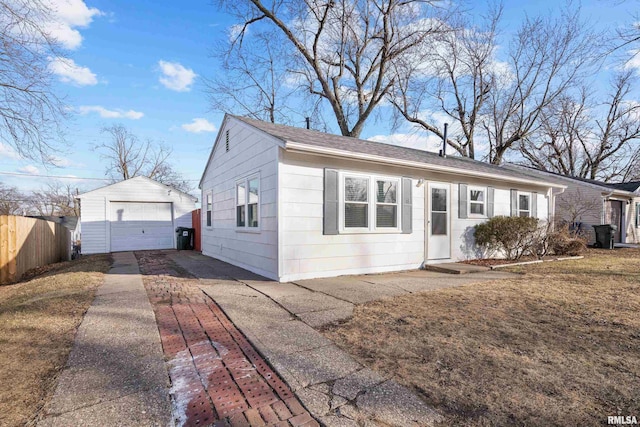 view of front of property with a garage and an outdoor structure