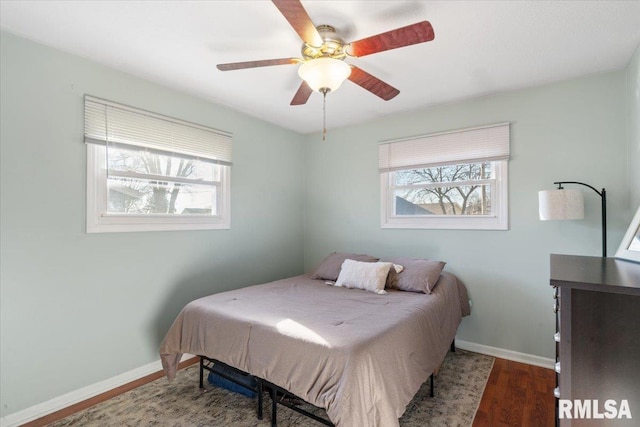 bedroom featuring hardwood / wood-style floors and ceiling fan