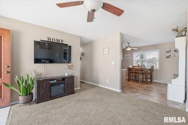 carpeted living room with a textured ceiling