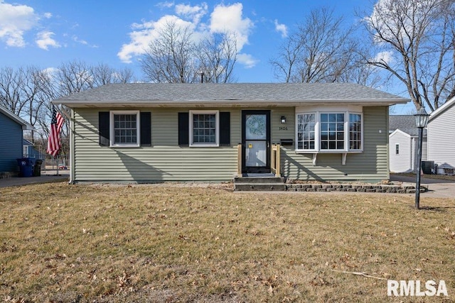 view of front of property featuring a front yard and central air condition unit