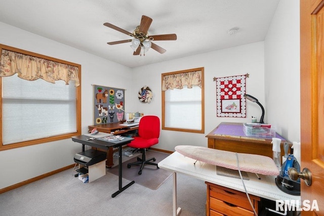 home office with ceiling fan and carpet