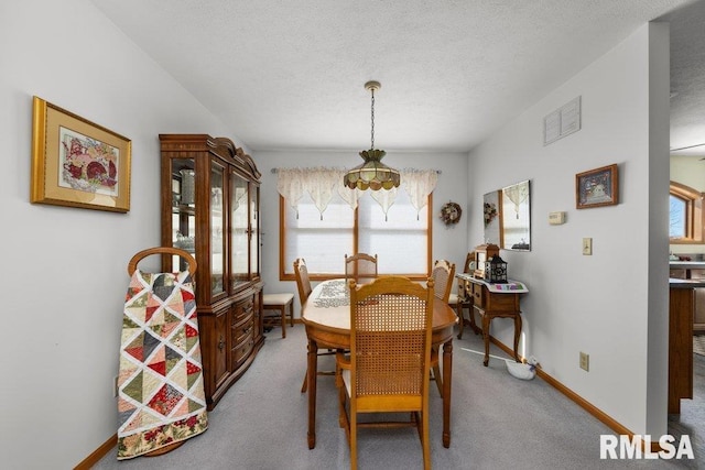 view of carpeted dining area