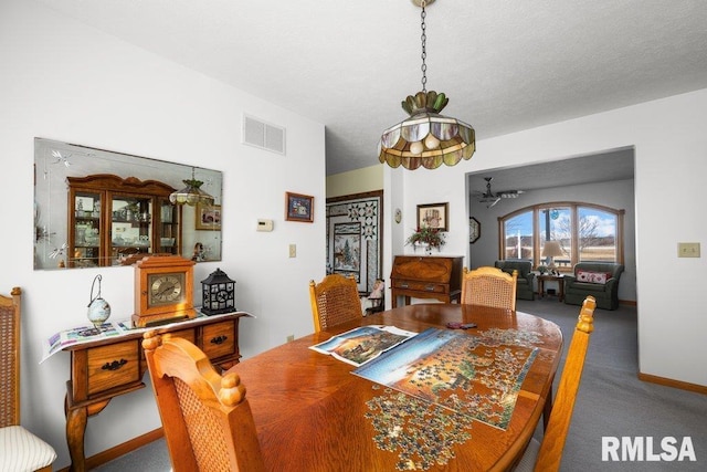 dining space with carpet floors