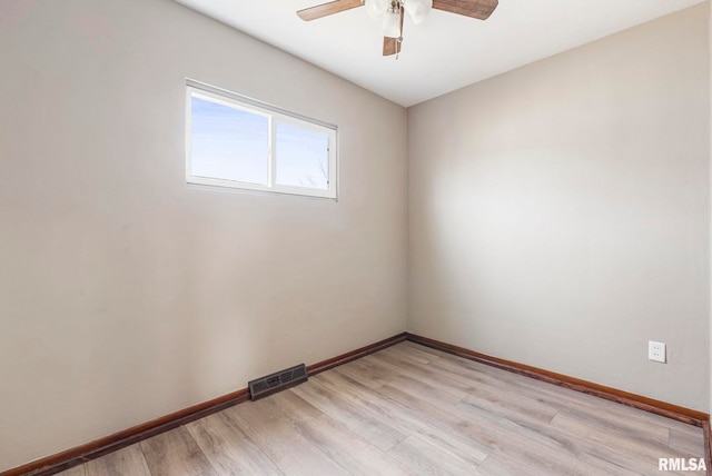 spare room with ceiling fan and light hardwood / wood-style flooring