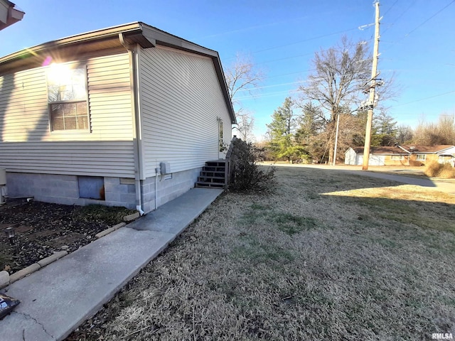 view of home's exterior featuring a yard