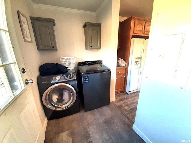 washroom featuring cabinets, crown molding, dark hardwood / wood-style flooring, and washer and clothes dryer