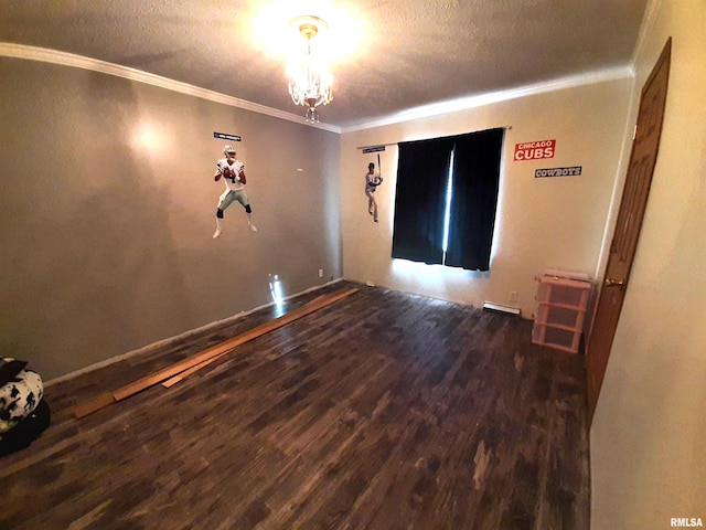 unfurnished room with crown molding, hardwood / wood-style flooring, and a textured ceiling