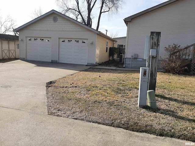 view of side of property with a garage