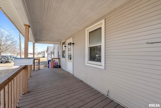 wooden terrace with a porch