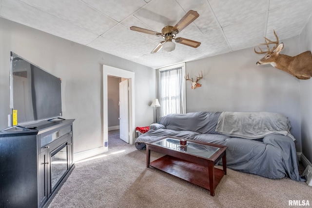 living room with carpet floors and ceiling fan