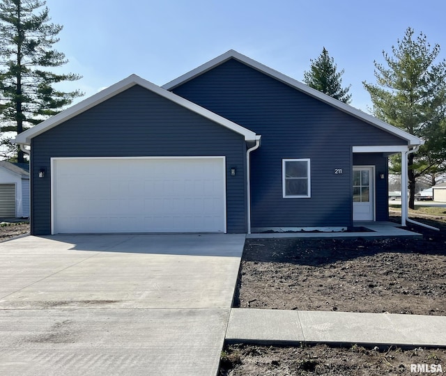 ranch-style house with driveway and a garage