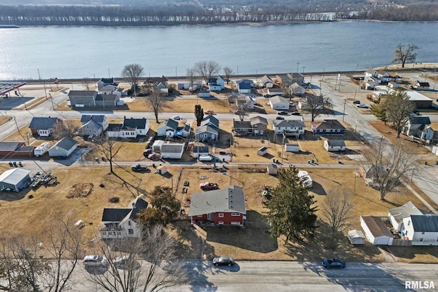 birds eye view of property featuring a water view and a residential view