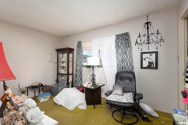 living area with carpet flooring and a notable chandelier