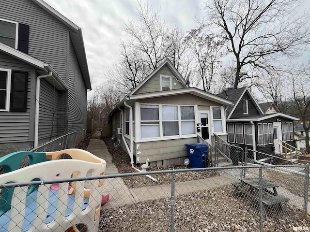 view of front of property with a sunroom