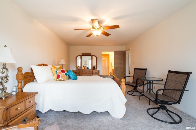 bedroom featuring ceiling fan and carpet