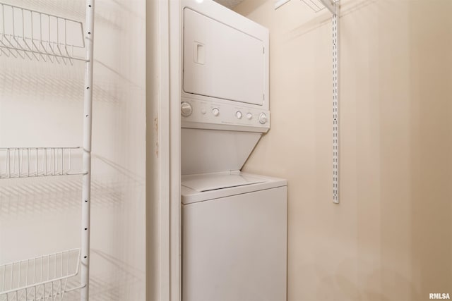 laundry room with stacked washer and clothes dryer