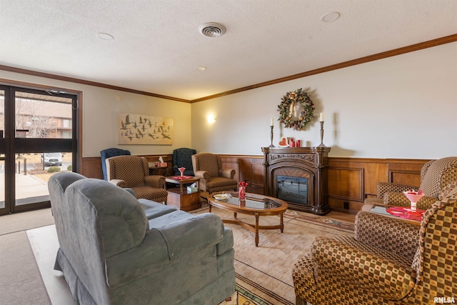 carpeted living room with crown molding and a textured ceiling