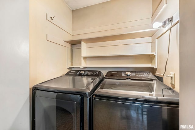 laundry room with separate washer and dryer