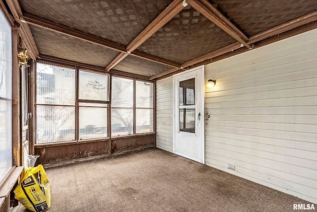 unfurnished sunroom featuring coffered ceiling