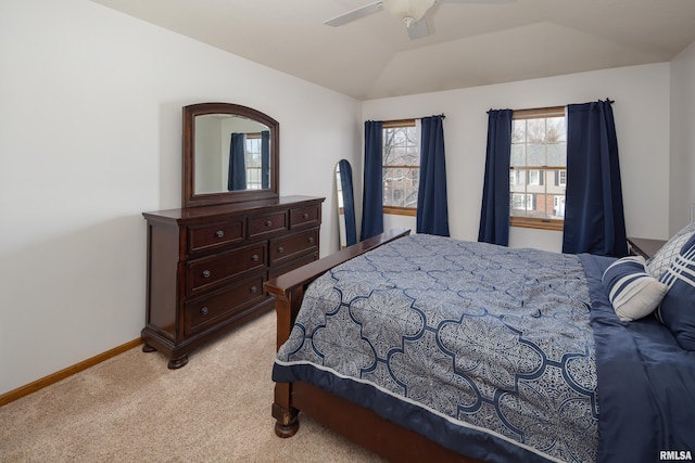 carpeted bedroom with lofted ceiling and ceiling fan