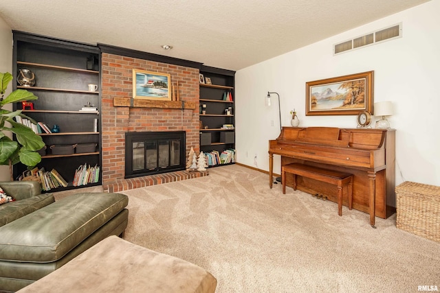 living room featuring carpet floors, a fireplace, a textured ceiling, and built in shelves