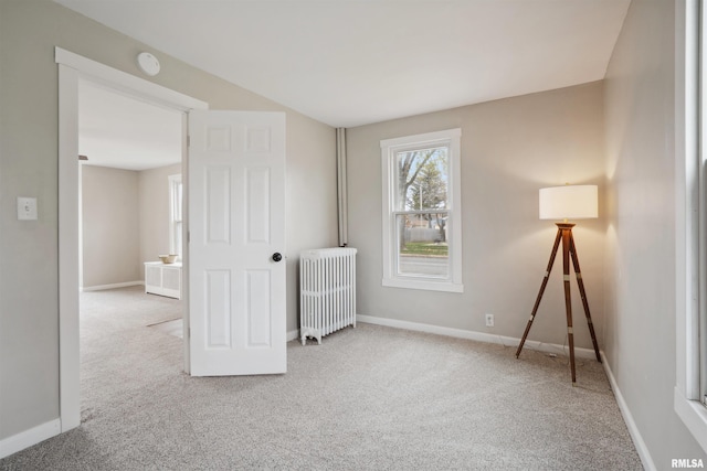 interior space with radiator and carpet