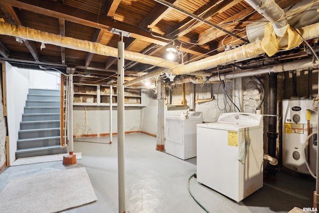 basement with water heater and washing machine and dryer