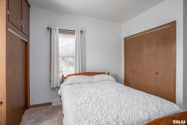 bedroom with carpet floors and a closet