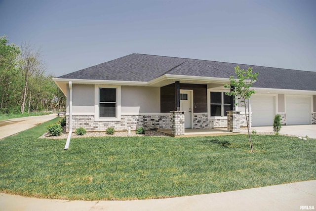 2803 N 23rd St Unit 1, Quincy, IL 62305 - view of front of home featuring an attached garage, concrete driveway, a front yard, a shingled roof, and covered porch