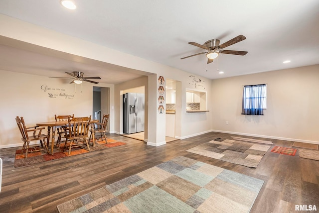 interior space featuring ceiling fan, baseboards, wood finished floors, and recessed lighting