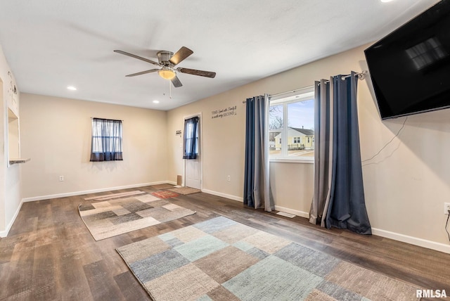 empty room with a ceiling fan, recessed lighting, baseboards, and wood finished floors