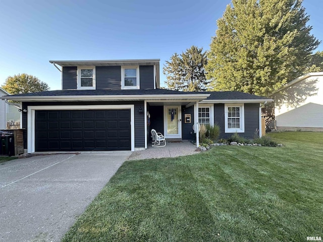 front facade featuring a garage and a front lawn