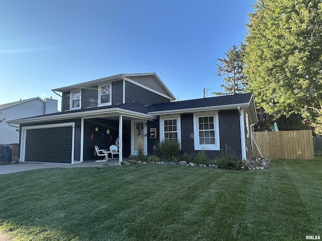 view of front facade with a garage and a front lawn