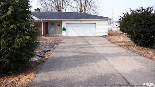 ranch-style house featuring a garage