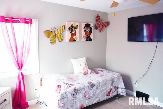 bedroom featuring light colored carpet and ceiling fan