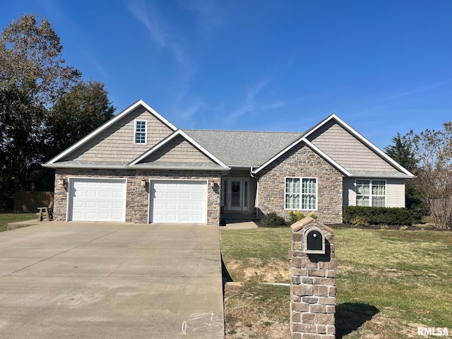 view of front facade with a garage and a front lawn