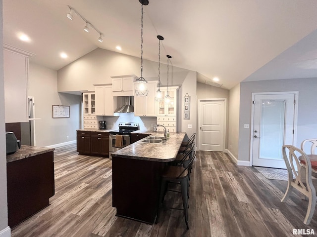 kitchen with white cabinetry, sink, a kitchen breakfast bar, wall chimney range hood, and stainless steel electric range