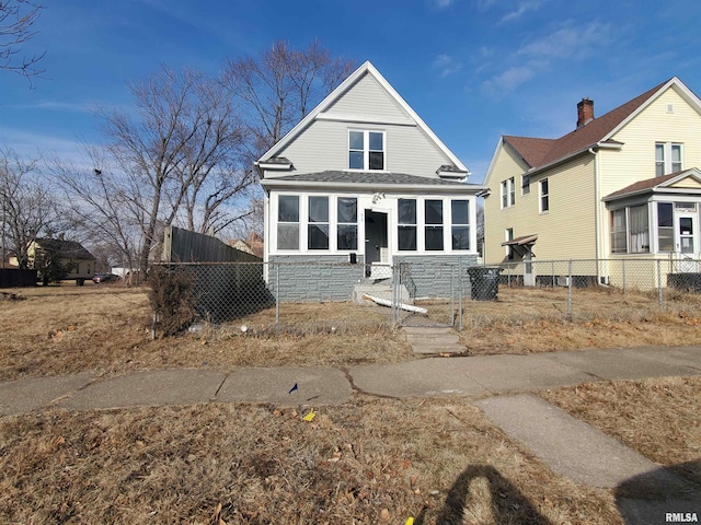 view of front of home featuring a sunroom